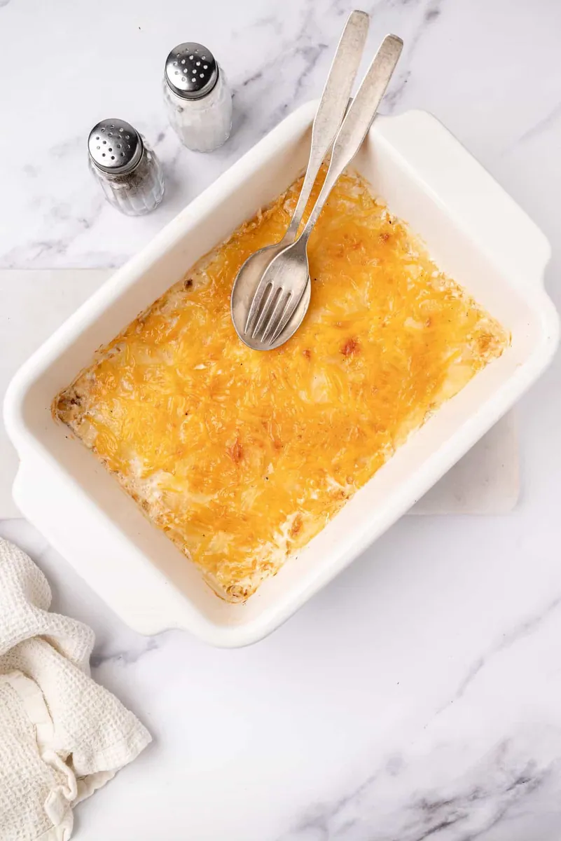 Cheesy Scalloped Potatoes with cheddar and shredded cheese