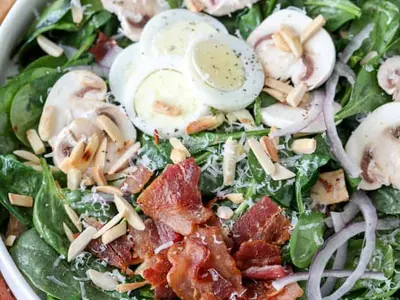 Spinach Salad with Bacon Dressing with nuts and seeds